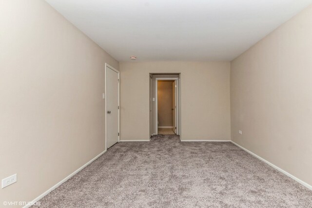 empty room featuring light carpet