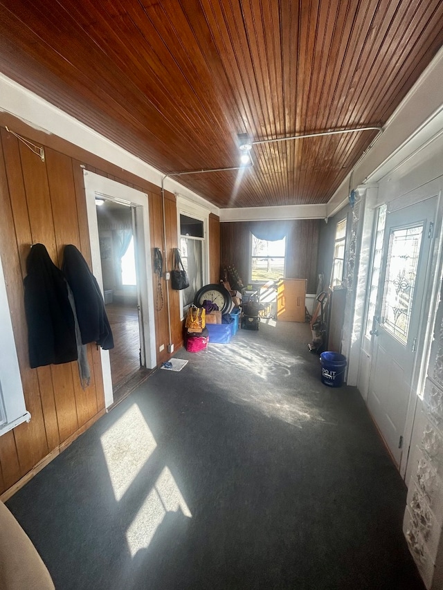 interior space with wooden ceiling and wood walls