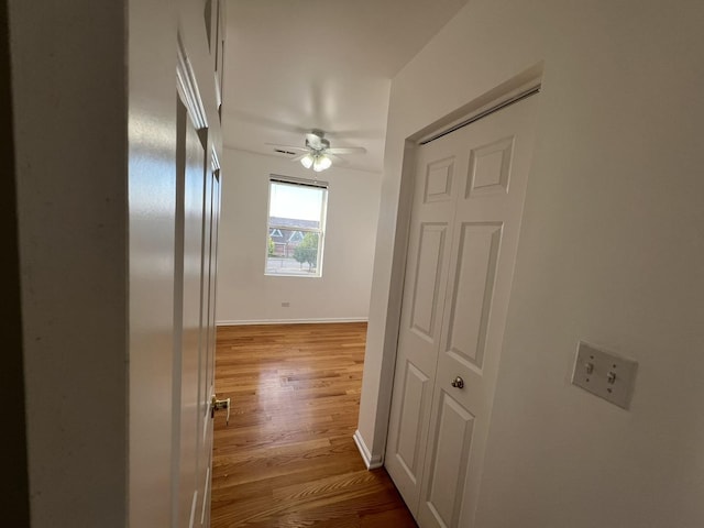 hall with light hardwood / wood-style flooring