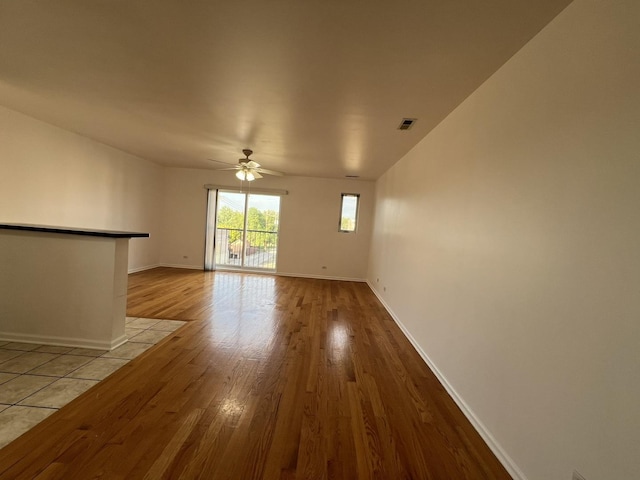 unfurnished room featuring ceiling fan and light wood-type flooring