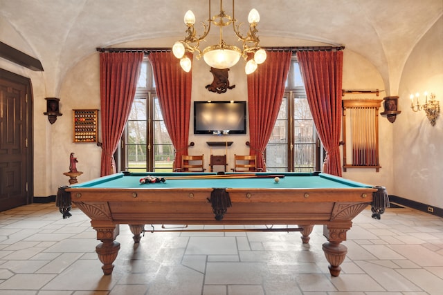 rec room with light tile floors, billiards, and an inviting chandelier