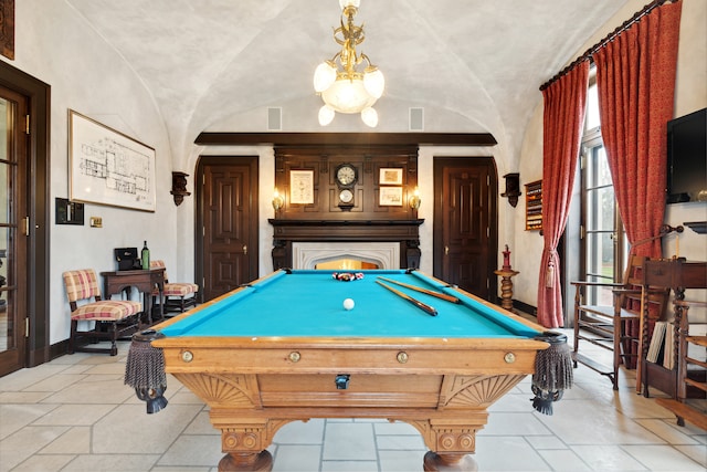 rec room with vaulted ceiling, light tile floors, and billiards