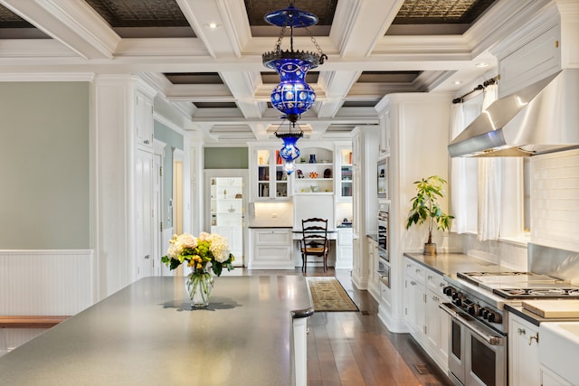 kitchen featuring white cabinets, stainless steel appliances, dark hardwood / wood-style flooring, and coffered ceiling