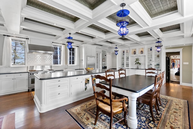 dining room with dark hardwood / wood-style flooring, crown molding, and coffered ceiling