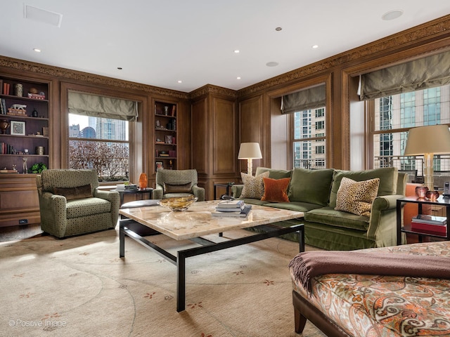 living area with light colored carpet and built in features