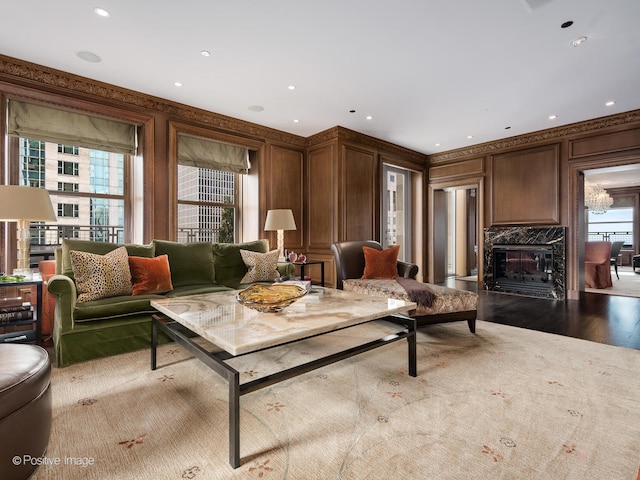 living room with light hardwood / wood-style floors and a premium fireplace