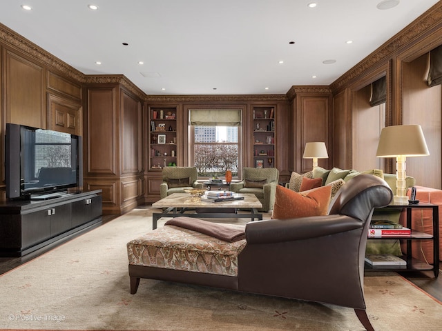 living room featuring crown molding, built in features, and wood-type flooring