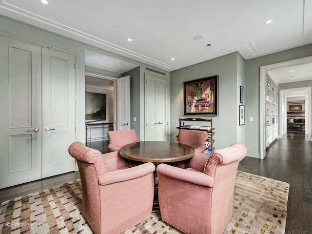 dining area featuring built in shelves and light hardwood / wood-style floors