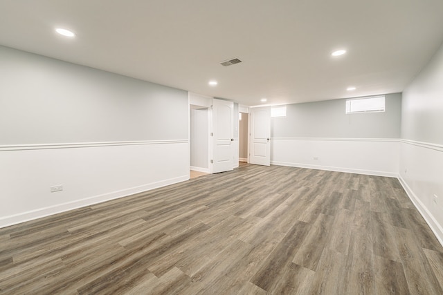 basement featuring dark hardwood / wood-style floors