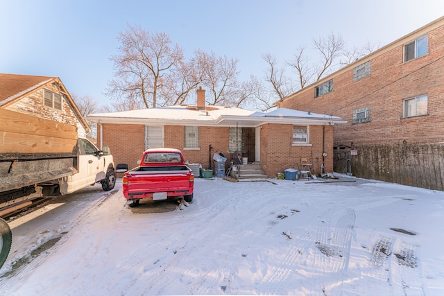 view of snow covered house