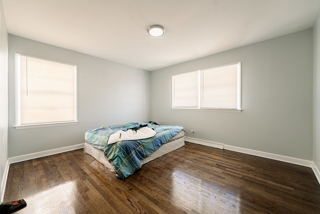 bedroom featuring dark hardwood / wood-style floors