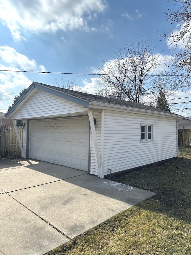 garage featuring a yard