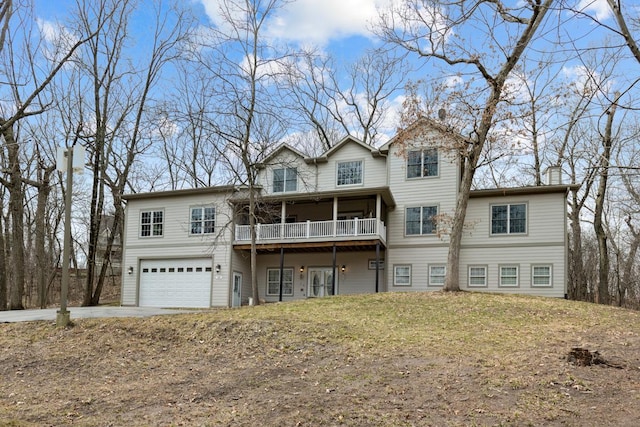 back of property with a garage