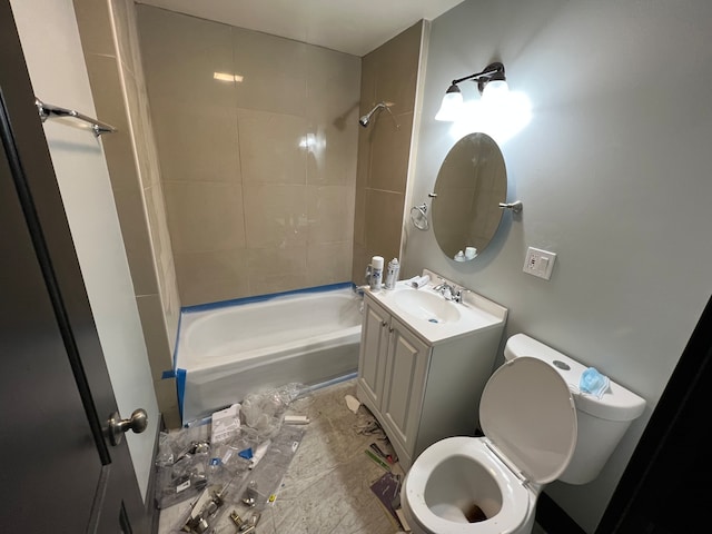 full bathroom featuring tiled shower / bath combo, tile floors, toilet, and vanity