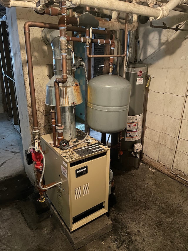 utility room featuring water heater