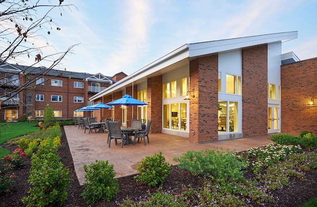 back of property featuring a patio area