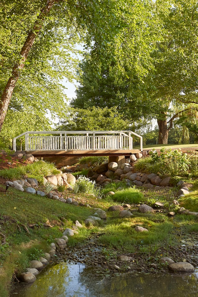 wooden deck with a water view