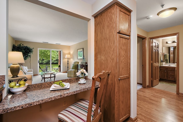 dining space with light wood-type flooring