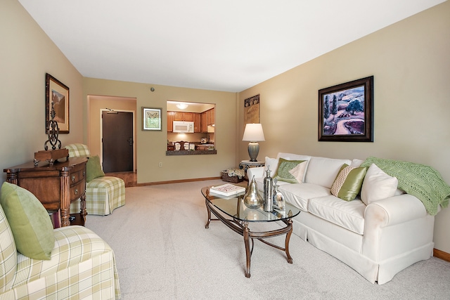 living room featuring light carpet