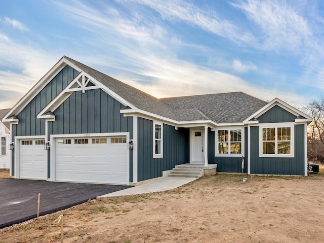 ranch-style house featuring a garage