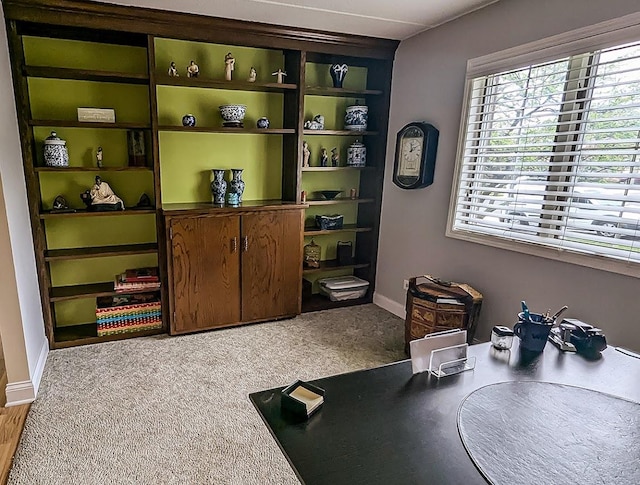 interior space featuring baseboards