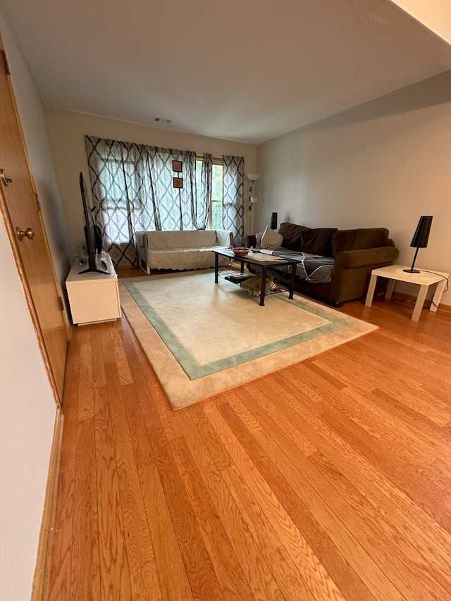 living room with light hardwood / wood-style floors