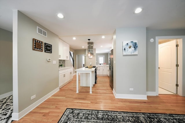 hallway featuring light hardwood / wood-style flooring