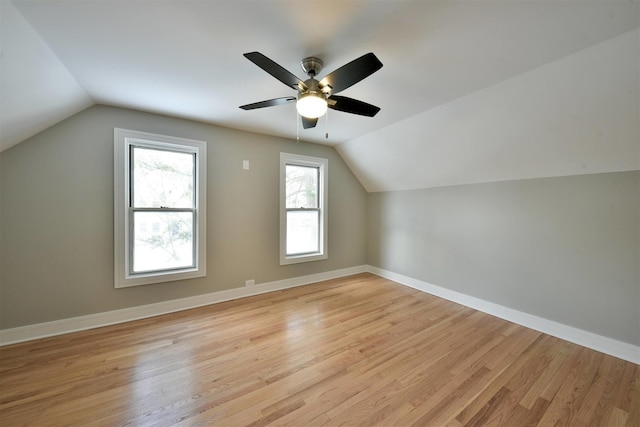 bonus room with vaulted ceiling, light hardwood / wood-style floors, and ceiling fan