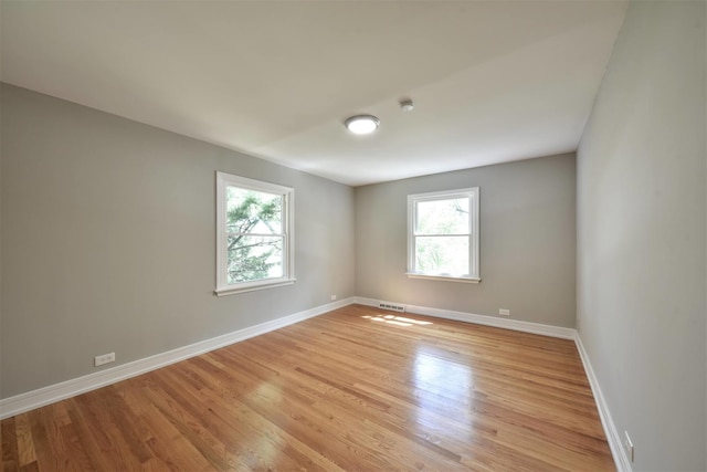 spare room with light hardwood / wood-style floors