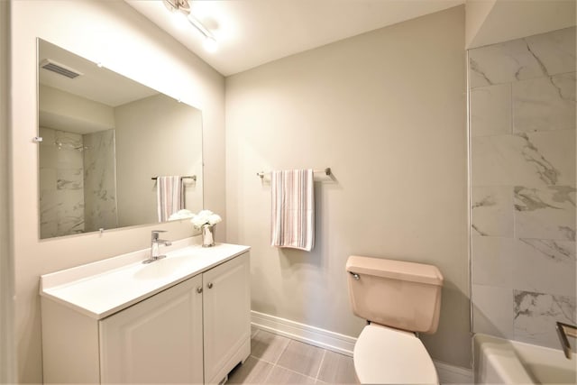 full bathroom featuring tiled shower / bath, vanity, toilet, and tile floors