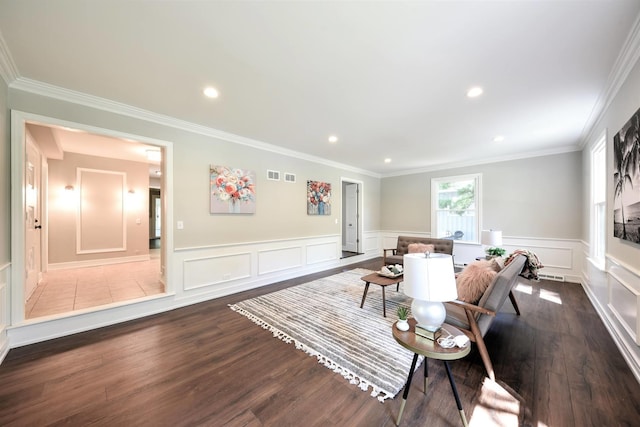 living room with ornamental molding and dark hardwood / wood-style floors