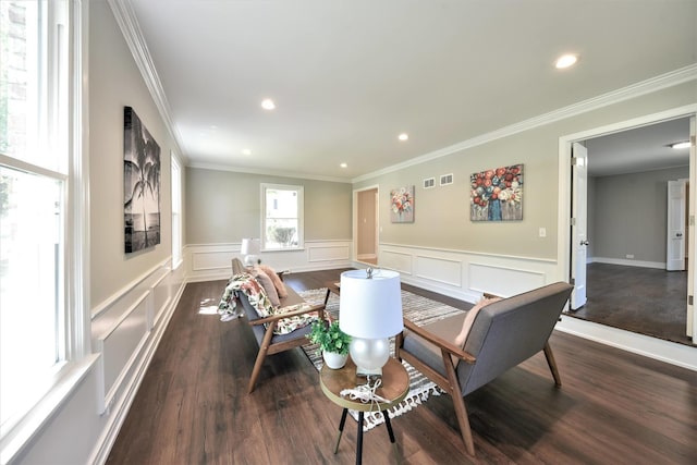 dining room with ornamental molding and dark hardwood / wood-style floors