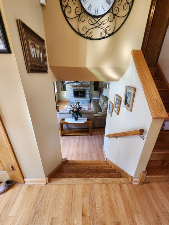 staircase with light hardwood / wood-style floors