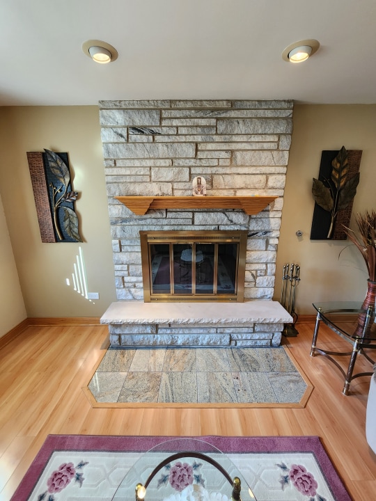 living room featuring a fireplace and light hardwood / wood-style flooring