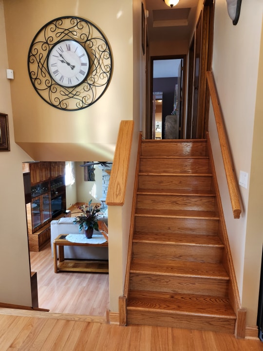 staircase featuring light wood-type flooring