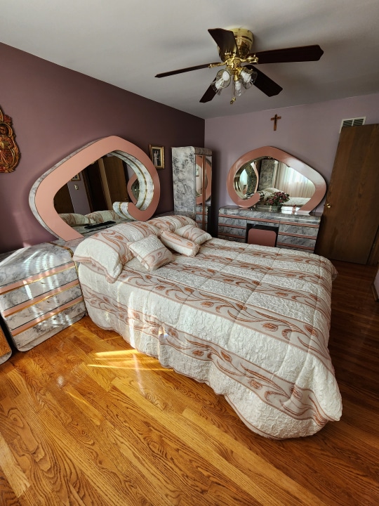 bedroom featuring ceiling fan and hardwood / wood-style flooring