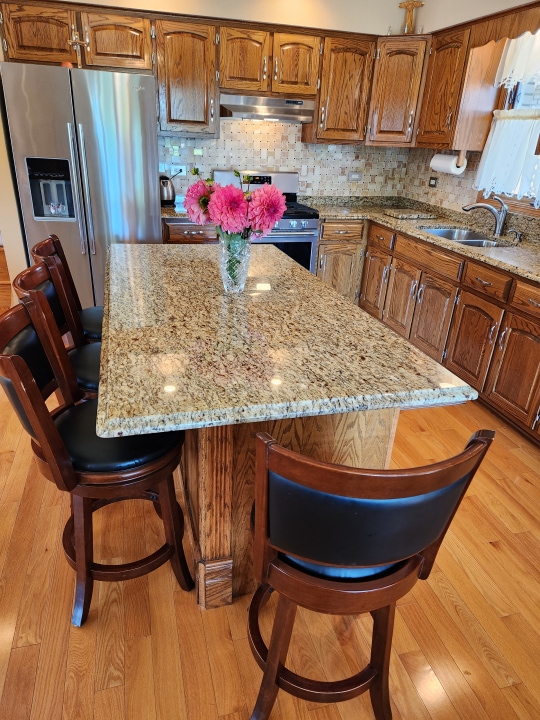 kitchen with backsplash, light hardwood / wood-style flooring, sink, and stainless steel appliances