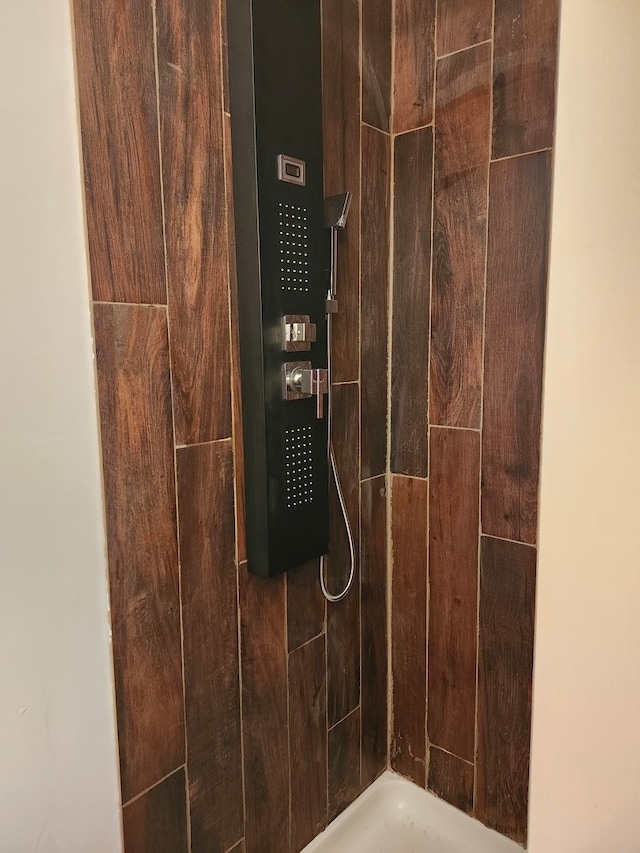 interior space featuring tiled shower