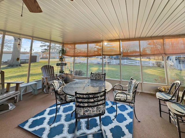 sunroom / solarium with ceiling fan and wooden ceiling