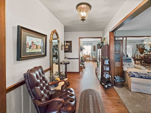 sitting room featuring light carpet