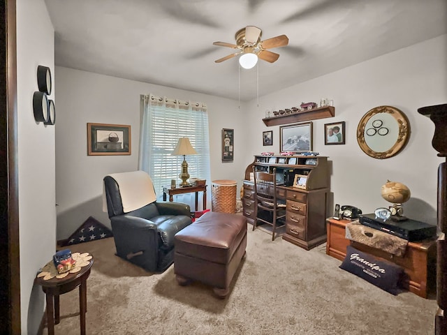 sitting room with carpet flooring and ceiling fan