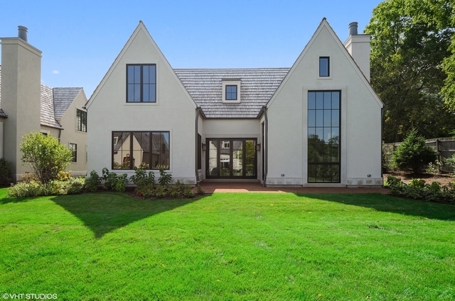 rear view of house with a lawn