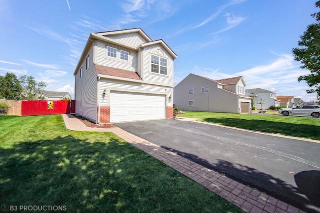 front of property with a front yard and a garage