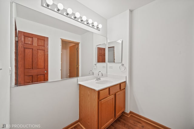 bathroom with vanity and hardwood / wood-style flooring