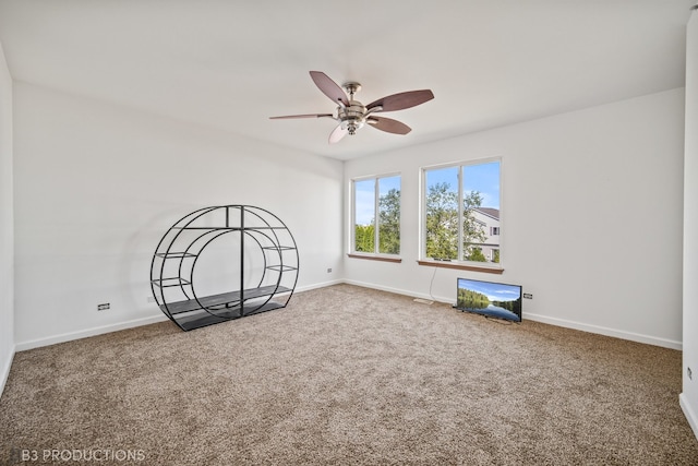 carpeted empty room with ceiling fan