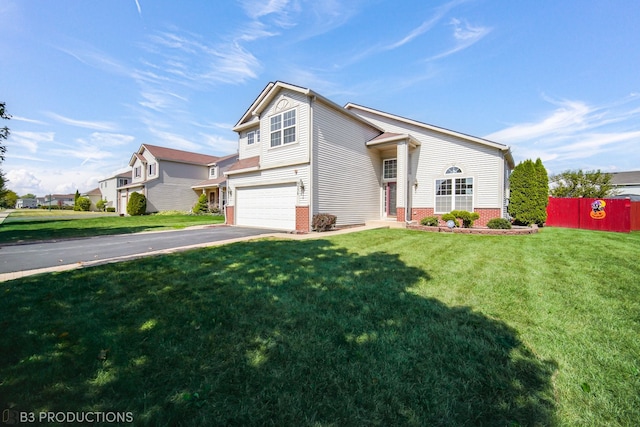 front facade with a front yard and a garage