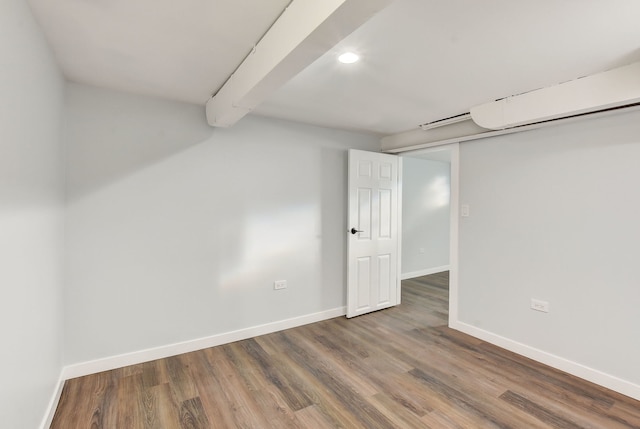 basement with dark hardwood / wood-style floors