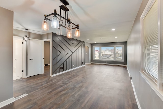 interior space featuring a notable chandelier and dark hardwood / wood-style floors