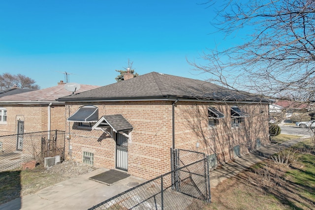 view of side of home featuring central AC unit