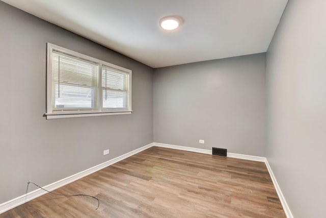 unfurnished room with light hardwood / wood-style flooring